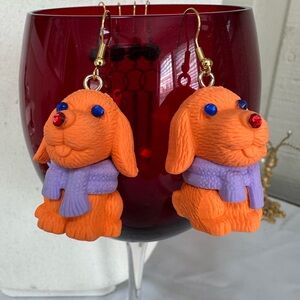 Orange dog with purple scarf earrings